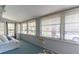 Bright sunroom with large windows, a comfortable sofa, and plenty of natural light at 116 E Plantation Blvd, Lake Mary, FL 32746