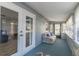 Relaxing sunroom with bright light, carpet floor, neutral paint, and comfortable seating at 116 E Plantation Blvd, Lake Mary, FL 32746