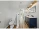 Bathroom boasts double sink vanity with marble countertops and modern lighting at 1235 Arapaho Trl, Geneva, FL 32732