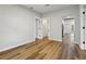 An airy bedroom boasts wood flooring with access to an en suite bathroom at 1235 Arapaho Trl, Geneva, FL 32732
