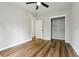 Spacious bedroom with wood floors, closet, and neutral paint throughout at 1235 Arapaho Trl, Geneva, FL 32732