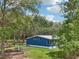 Charming blue home nestled in a serene, wooded setting offering peace and privacy at 1235 Arapaho Trl, Geneva, FL 32732