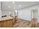 Bright kitchen boasts wood counters, sleek faucet, and stunning wood-look floors at 1235 Arapaho Trl, Geneva, FL 32732