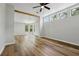 Bright and open living room featuring wood floors, high ceilings and abundant natural light at 1235 Arapaho Trl, Geneva, FL 32732