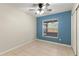 This bedroom has tiled floor, ceiling fan and a window with blinds at 1353 Ortega St, Winter Springs, FL 32708