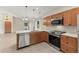 Updated kitchen featuring stainless steel appliances, modern finishes, and a view into the living area at 1353 Ortega St, Winter Springs, FL 32708