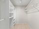 Walk-in closet with custom shelving for optimal storage and organization at 1353 Ortega St, Winter Springs, FL 32708