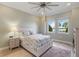 This bedroom offers great natural light and beautiful views of the lake at 13755 Benavente Ave, Orlando, FL 32827