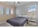 Cozy bedroom with a queen bed and windows with natural light at 13755 Benavente Ave, Orlando, FL 32827