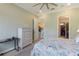 Spacious bedroom with a ceiling fan and a dresser at 13755 Benavente Ave, Orlando, FL 32827