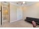 Versatile room with a futon and access to the staircase at 13755 Benavente Ave, Orlando, FL 32827