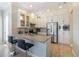 Modern kitchen features stainless steel appliances, granite countertops, and barstool seating at 13755 Benavente Ave, Orlando, FL 32827