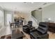 Bright and airy living area connects to the dining and kitchen with a view of the stairs at 13755 Benavente Ave, Orlando, FL 32827