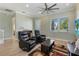 Inviting living room showcasing a ceiling fan, contemporary furniture, and a view of the outdoors at 13755 Benavente Ave, Orlando, FL 32827
