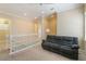 Inviting upstairs loft with a comfortable sofa and neutral decor at 13755 Benavente Ave, Orlando, FL 32827