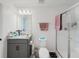 Bathroom featuring a shower, toilet, granite countertops sink, and soft lighting at 1471 Mirabella Cir, Davenport, FL 33897