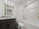 Bright bathroom with a bath, shower, granite countertop sink and soft lighting at 1471 Mirabella Cir, Davenport, FL 33897