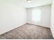 Bright bedroom with plush neutral carpet, and a window that provides plenty of light at 1471 Mirabella Cir, Davenport, FL 33897