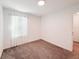 Cozy bedroom features neutral carpet, white walls, sheer curtains and good natural light at 1471 Mirabella Cir, Davenport, FL 33897