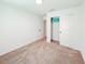 Bedroom featuring carpeted floor, white walls, and a closet with doors, for easy organization at 1471 Mirabella Cir, Davenport, FL 33897