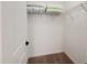 Walk-in closet boasts shelving and carpeted floor, perfect for organizing clothes and storage at 1471 Mirabella Cir, Davenport, FL 33897