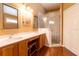 Main bathroom featuring double sinks with a vanity and a glass enclosed shower at 14831 Yorkshire Run Dr, Orlando, FL 32828