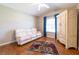 Cozy bedroom featuring a vaulted ceiling and laminate wood flooring at 14831 Yorkshire Run Dr, Orlando, FL 32828