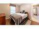 Bedroom with a window, wood flooring, and a double-door closet at 14831 Yorkshire Run Dr, Orlando, FL 32828
