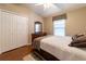 Bedroom with a window, wood flooring, and a double-door closet at 14831 Yorkshire Run Dr, Orlando, FL 32828
