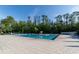 Large community pool surrounded by lush landscaping and comfortable lounge chairs at 14831 Yorkshire Run Dr, Orlando, FL 32828