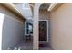 Inviting front entry featuring a decorative wreath and landscaped flowerbeds at 14831 Yorkshire Run Dr, Orlando, FL 32828