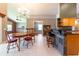 Eat-in kitchen features a breakfast bar with seating and an adjacent dining area at 14831 Yorkshire Run Dr, Orlando, FL 32828