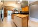 Well-lit kitchen boasts an island with a butcher block top and stylish pendant lighting at 14831 Yorkshire Run Dr, Orlando, FL 32828