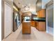 Spacious kitchen with stainless steel appliances and center island, perfect for entertaining at 14831 Yorkshire Run Dr, Orlando, FL 32828