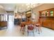The eat-in kitchen includes stainless appliances, breakfast bar, and a chandelier above the dining table at 14831 Yorkshire Run Dr, Orlando, FL 32828