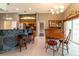 View of the eat-in kitchen boasting stainless appliances and a breakfast bar with seating at 14831 Yorkshire Run Dr, Orlando, FL 32828