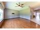 Spacious living room with hardwood flooring, neutral walls, and a ceiling fan at 14831 Yorkshire Run Dr, Orlando, FL 32828