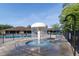 Community splash pad with a mushroom water feature and pool in the background at 14831 Yorkshire Run Dr, Orlando, FL 32828