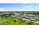 A beautiful aerial view of a community with homes nestled around a serene lake at 1551 Gateway Ln, Kissimmee, FL 34746