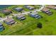 Aerial view showcasing homes with pools and well-manicured lawns in a vibrant community at 1551 Gateway Ln, Kissimmee, FL 34746