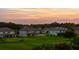 Scenic backyard view, with lush greenery and well-maintained homes in a peaceful setting at 1551 Gateway Ln, Kissimmee, FL 34746