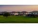 Expansive backyards, offering ample space for outdoor activities, with homes at dusk at 1551 Gateway Ln, Kissimmee, FL 34746