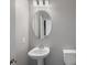Bathroom featuring modern sink, commode, and decor at 1551 Gateway Ln, Kissimmee, FL 34746