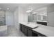 A spacious bathroom featuring dual vanities, a modern bathtub and a glass shower at 1551 Gateway Ln, Kissimmee, FL 34746
