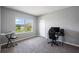 Spacious bedroom featuring a large window and versatile space, perfect for a home office or creative studio at 1551 Gateway Ln, Kissimmee, FL 34746