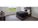 Comfortable bedroom with rustic wood furnishings and a scenic view from the window at 1551 Gateway Ln, Kissimmee, FL 34746