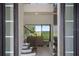 Entryway featuring a staircase and a view into the living room at 1551 Gateway Ln, Kissimmee, FL 34746