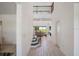 Bright foyer with tile flooring, staircase, and views into the living room at 1551 Gateway Ln, Kissimmee, FL 34746
