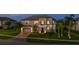 Stunning two-story home with a paved driveway and lush landscaping at 1551 Gateway Ln, Kissimmee, FL 34746
