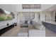 Open concept living room featuring a spacious layout with a sectional sofa, and views of the kitchen at 1551 Gateway Ln, Kissimmee, FL 34746